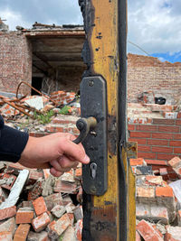Close-up of hand holding metal