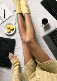 High angle view of woman using laptop on table