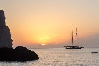 Scenic view of calm sea at sunset
