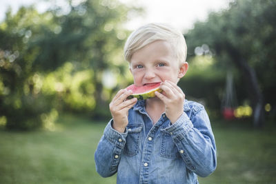 Portrait of boy eating food