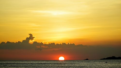 Scenic view of sea at sunset