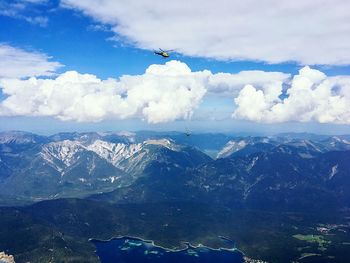 Aerial view of snowcapped mountains against sky