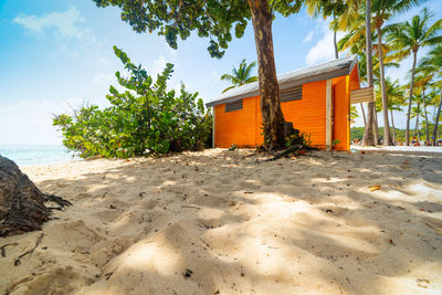 Built structure on beach against sky