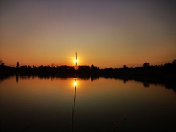 Scenic view of lake against romantic sky at sunset