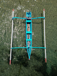 High angle view of information sign by sea