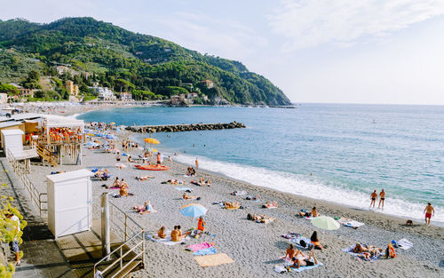 High angle view of people at beach against sky