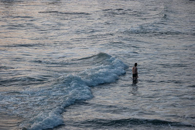 High angle view of man walking on beach