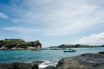 Scenic view of bay against sky