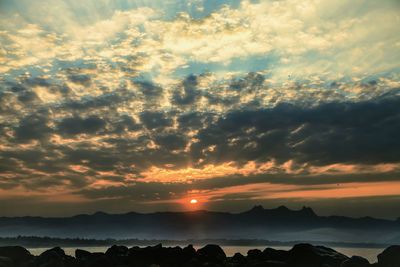 Scenic view of dramatic sky during sunset