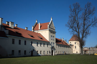 Built structures against clear blue sky