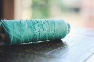 Close-up of turquoise thread spool