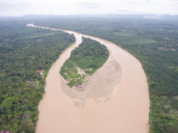 High angle view of river amidst landscape against sky