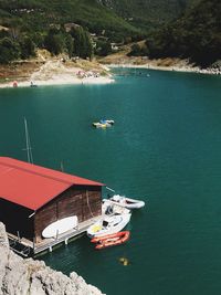 High angle view of sailboats moored on sea