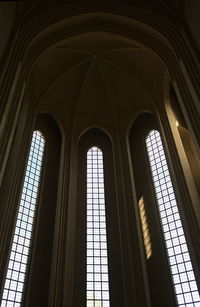 Low angle view of glass window in building