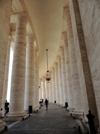 Low angle view of people at historical building