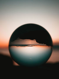 Close-up of crystal ball on table