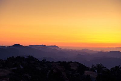 Scenic view of mountains at sunset