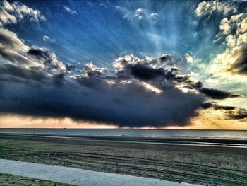 Scenic view of sea against dramatic sky