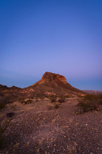Scenic view of mountains against clear blue sky