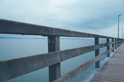 Pier over sea against sky