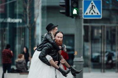 Young couple looking at city street