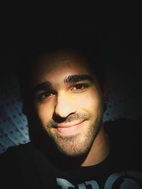 Close-up portrait of smiling young man