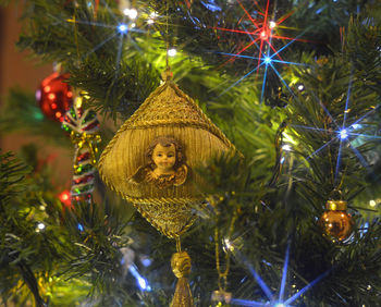 Close-up of illuminated christmas tree at night