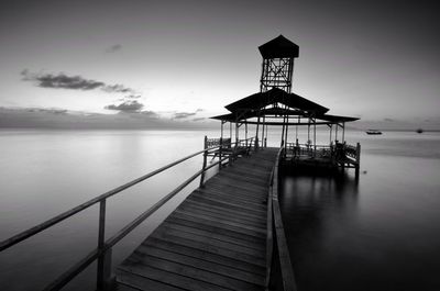 Pier over sea against sky