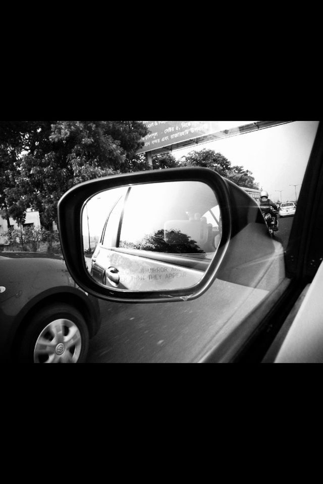 transportation, mode of transport, car, land vehicle, side-view mirror, reflection, vehicle interior, glass - material, car interior, transparent, window, travel, road, street, windshield, part of, mirror, close-up, sky, on the move