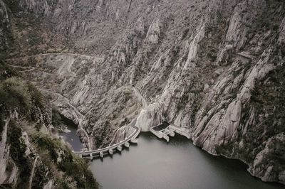 High angle view of river amidst mountains