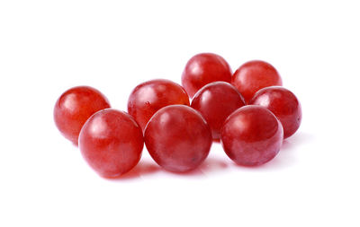 Close-up of cherries against white background