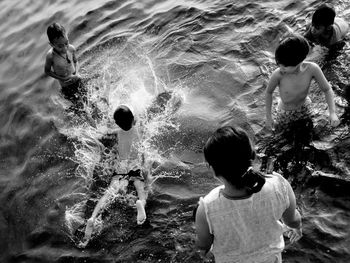 Boy standing in water