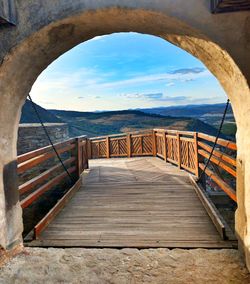 Scenic view of sea against sky seen through arch