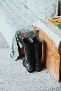 High angle view of boots on footpath