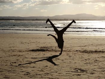 Scenic view of person on beach