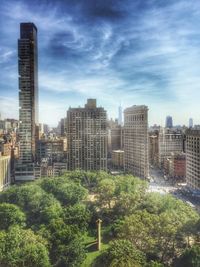 Skyscrapers in city against sky