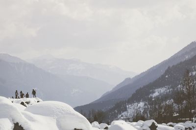 Scenic view of mountains against sky during winter