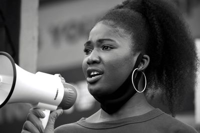 Close-up portrait of woman looking away
