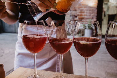 Close-up of wine glasses on table