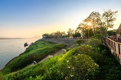 Scenic view of sea against clear sky during sunset