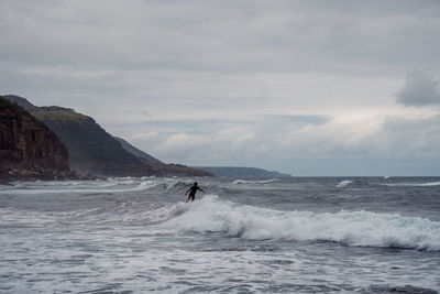 Person surfing at the stanwell park beach reserve