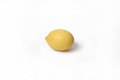 Close-up of lemon slice against white background