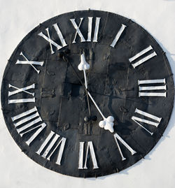 Close-up of clock on wall