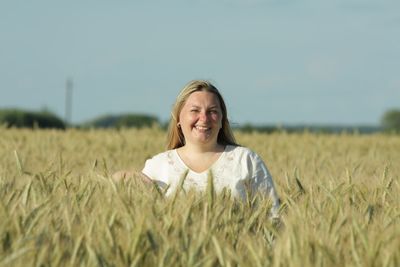 Portrait of a smiling young man on field