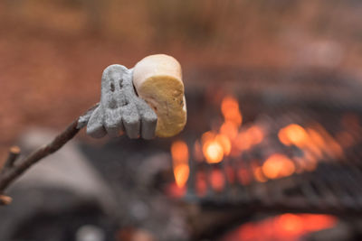 Close-up of marshmallow against barbecue grill