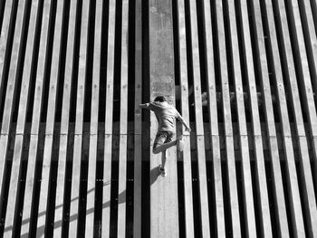 Low angle view of man jumping on wall