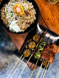 Chinese fried rice with vegetables, mushrooms, and pork satay bbq