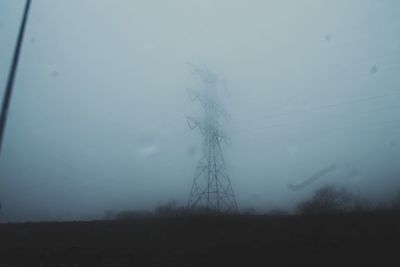 Trees on field against sky