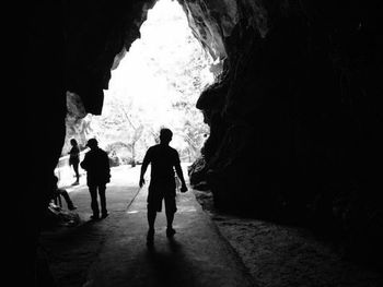 People walking in cave