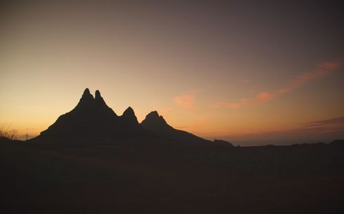 Scenic view of silhouette mountain against sky during sunset